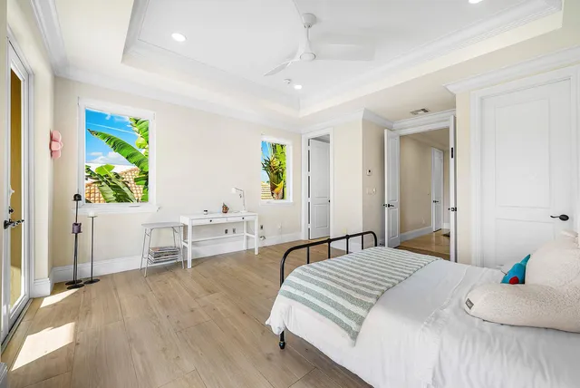 a view of a house with backyard porch and sitting area