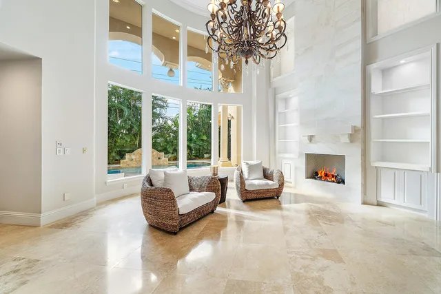 a living room with kitchen island furniture and a flat screen tv