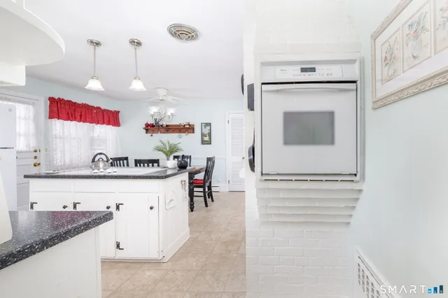 a kitchen with a refrigerator and cabinets