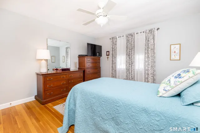 a bedroom with a bed and a dresser