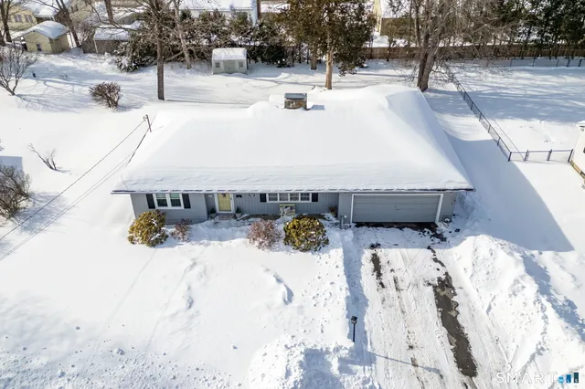 a view of snow on the road