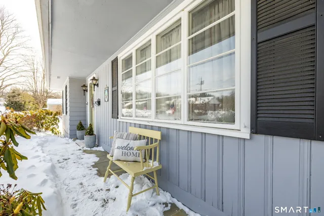 a view of a chair and table in the balcony
