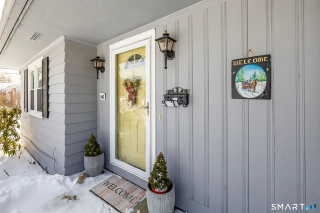 a view of an entryway with wooden floor