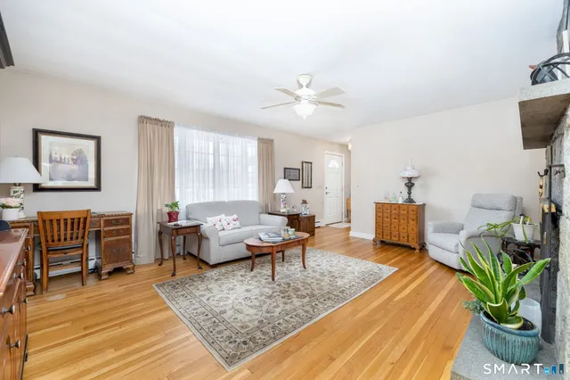 a living room with furniture and a rug