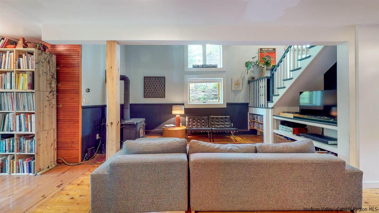 209-211 Fish Creek Road Saugerties, NY 12477 - Photo 14 of 35 a living room with furniture and a book shelf