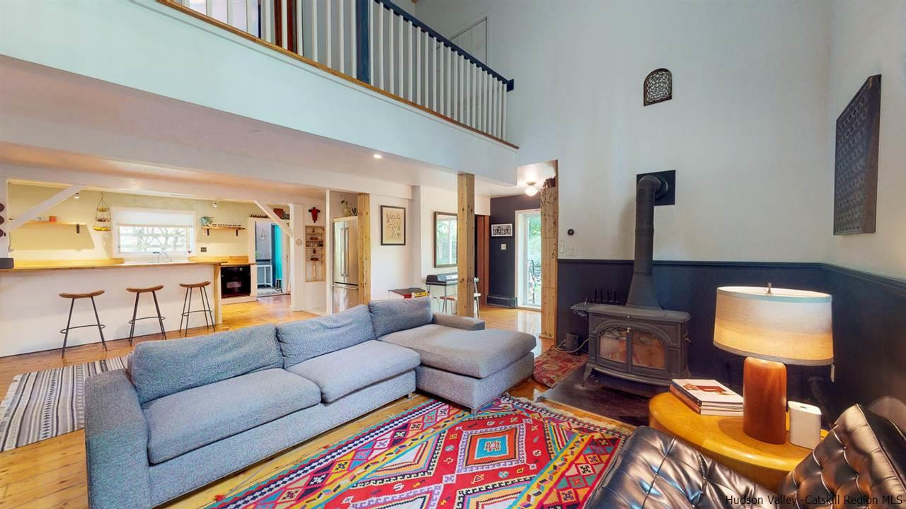 209-211 Fish Creek Road Saugerties, NY 12477 - Photo 15 of 35 a living room with furniture and a lamp