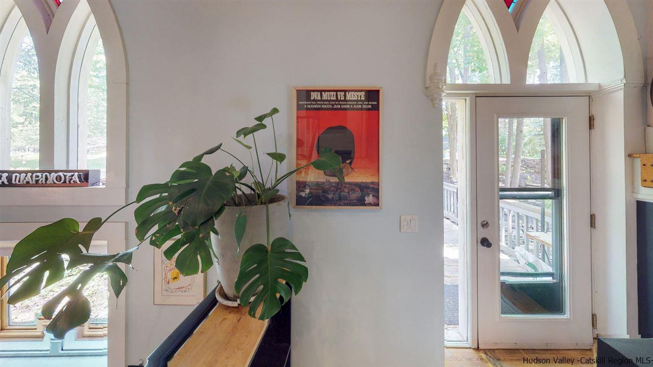 209-211 Fish Creek Road Saugerties, NY 12477 - Photo 18 of 35 a vase of flowers sitting next to a window
