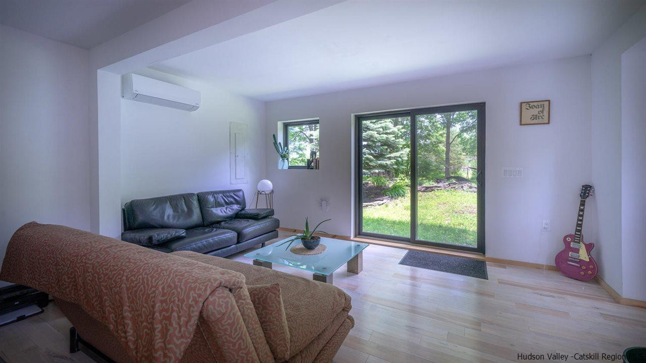 209-211 Fish Creek Road Saugerties, NY 12477 - Photo 29 of 35 a living room with furniture and a large window
