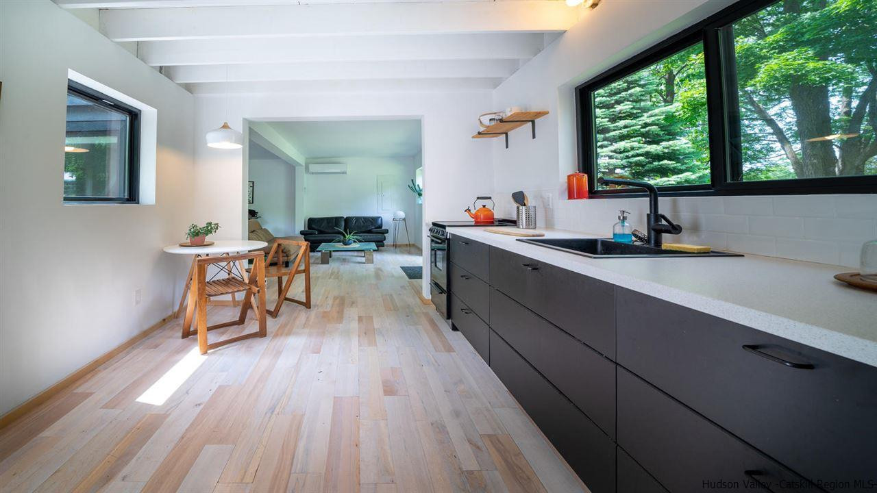 209-211 Fish Creek Road Saugerties, NY 12477 - Photo 30 of 35 a kitchen with a sink and wooden floor