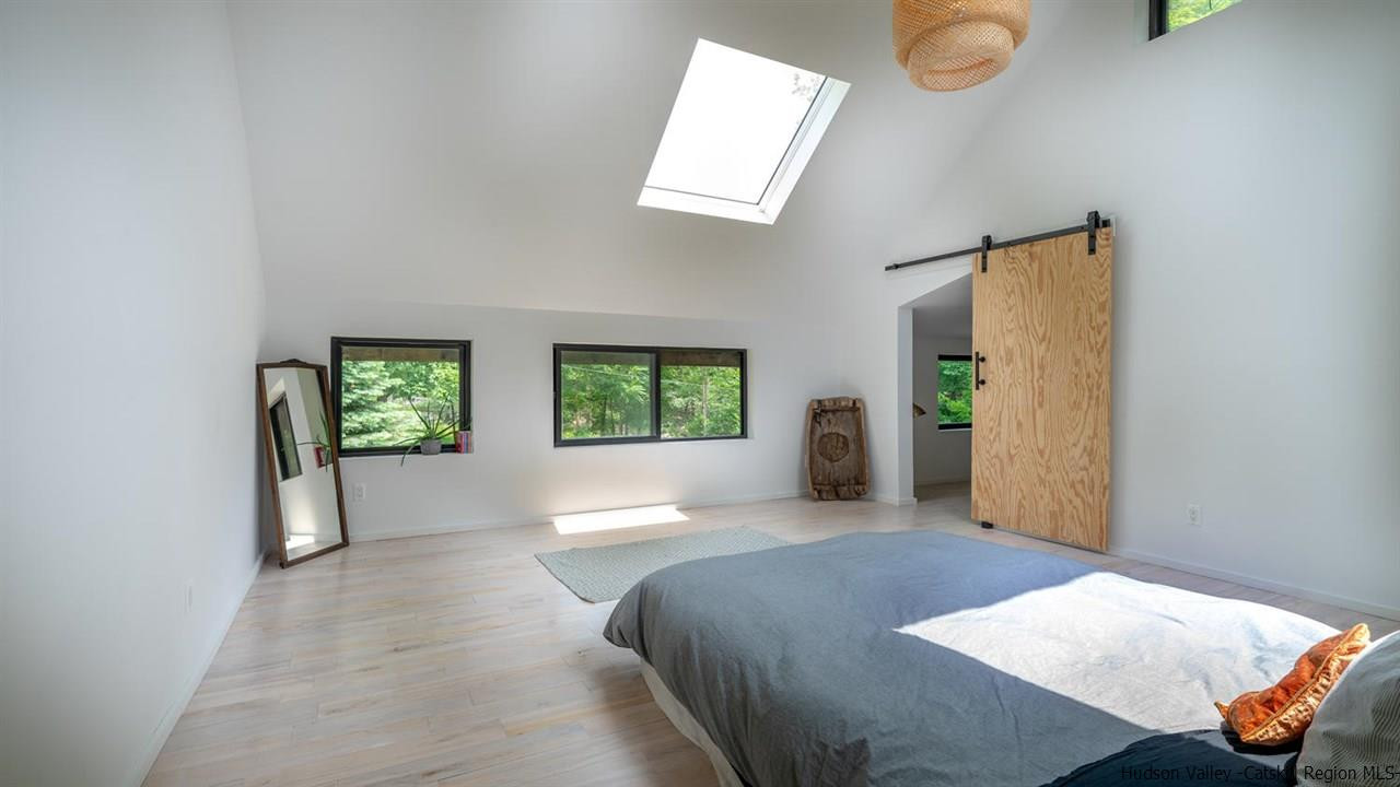 209-211 Fish Creek Road Saugerties, NY 12477 - Photo 34 of 35 a spacious bedroom with a bed and a window