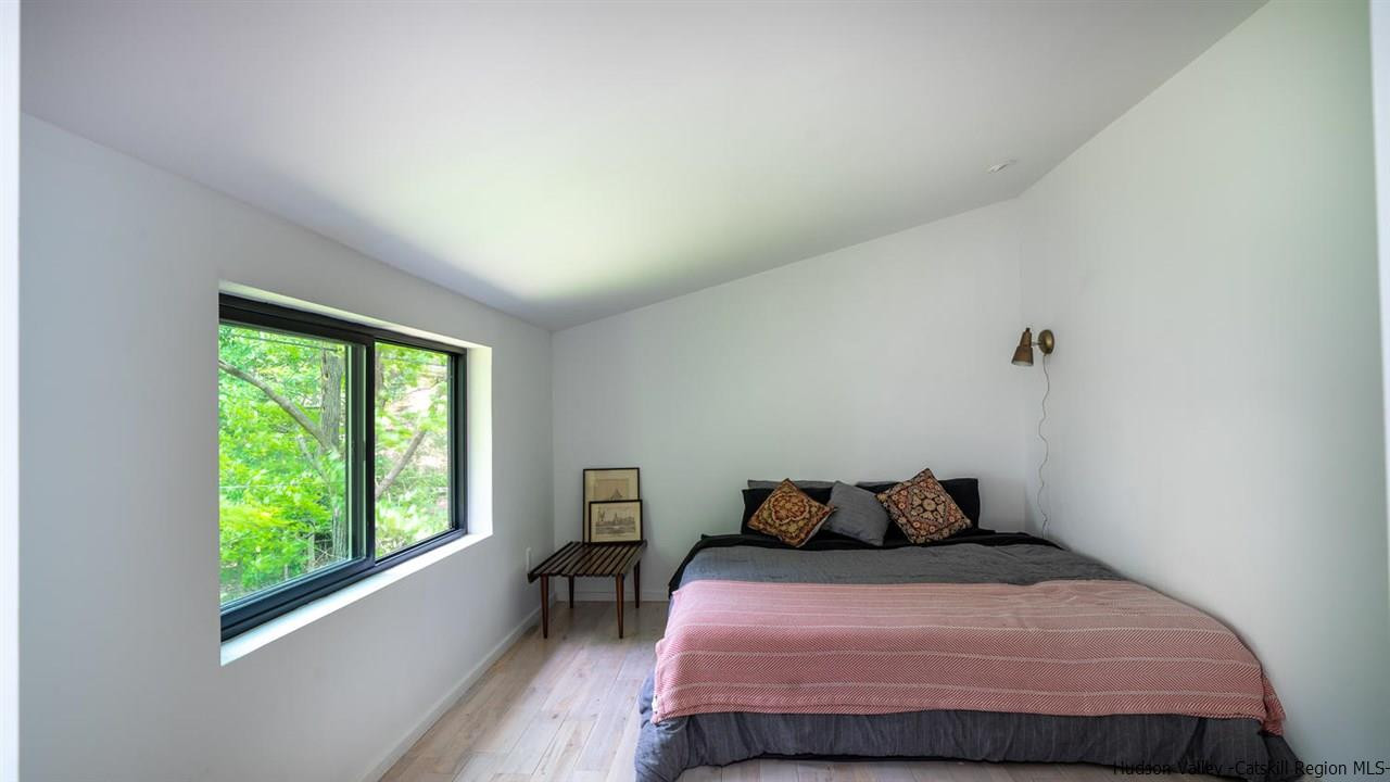 209-211 Fish Creek Road Saugerties, NY 12477 - Photo 35 of 35 a bedroom with a bed and wooden floor