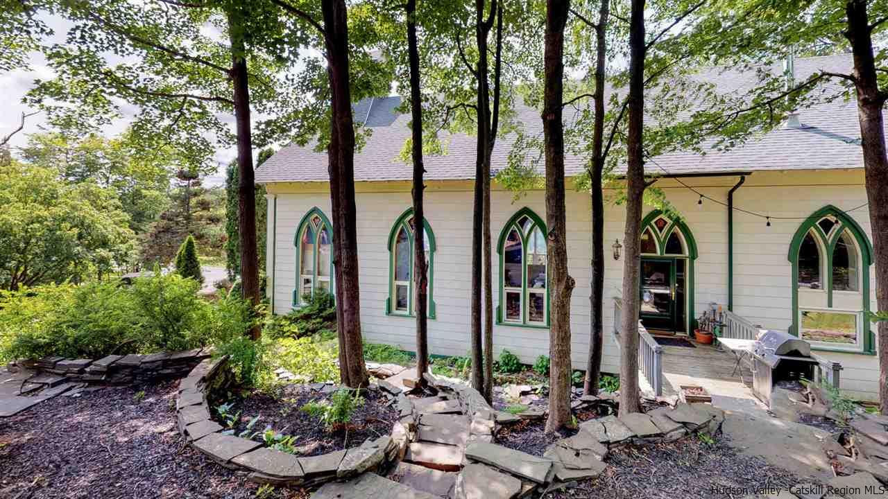 209-211 Fish Creek Road Saugerties, NY 12477 - Photo 4 of 35 a view of a chairs and fire pit in front of a large tree