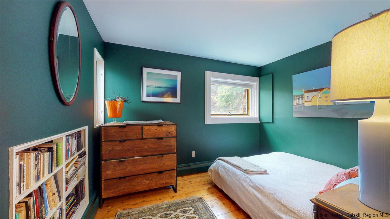 209-211 Fish Creek Road Saugerties, NY 12477 - Photo 10 of 35 a bedroom with a bed and a mirror