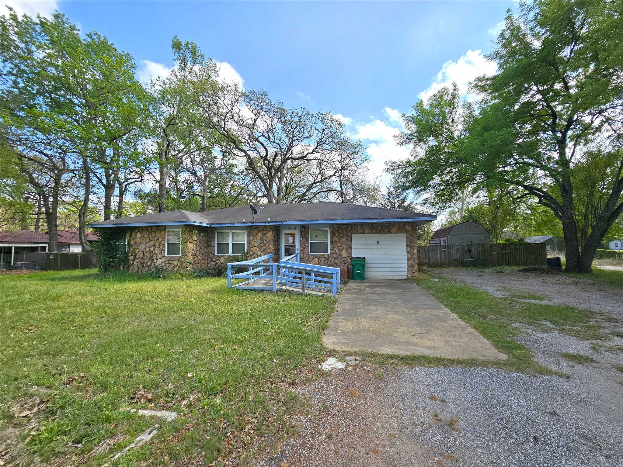 216 Westwood Road Palestine, TX 75803 - Photo 1 of 23 a front view of a house with garden
