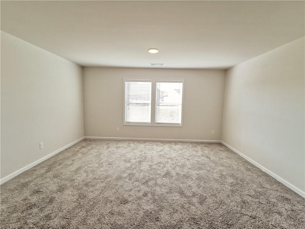 38 Longhorn Way Auburn, GA 30011 - Photo 21 of 36 an empty room with a window