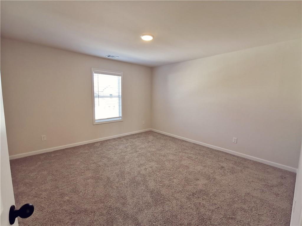 38 Longhorn Way Auburn, GA 30011 - Photo 22 of 36 an empty room with windows