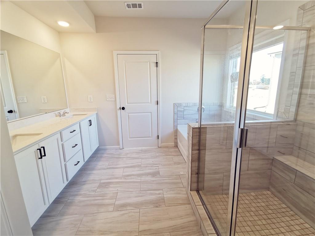 38 Longhorn Way Auburn, GA 30011 - Photo 28 of 36 a bathroom with a double vanity sink and a mirror