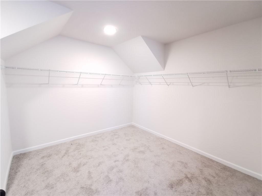 38 Longhorn Way Auburn, GA 30011 - Photo 29 of 36 a view of a room with racks on the wall