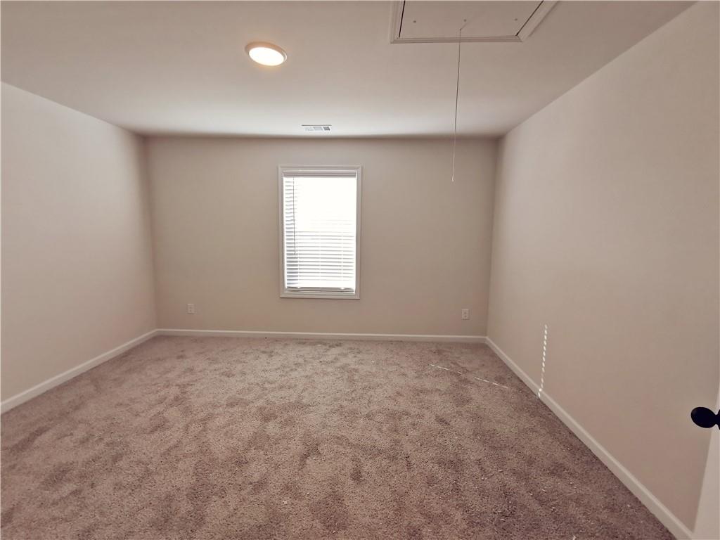 38 Longhorn Way Auburn, GA 30011 - Photo 30 of 36 an empty room with a window