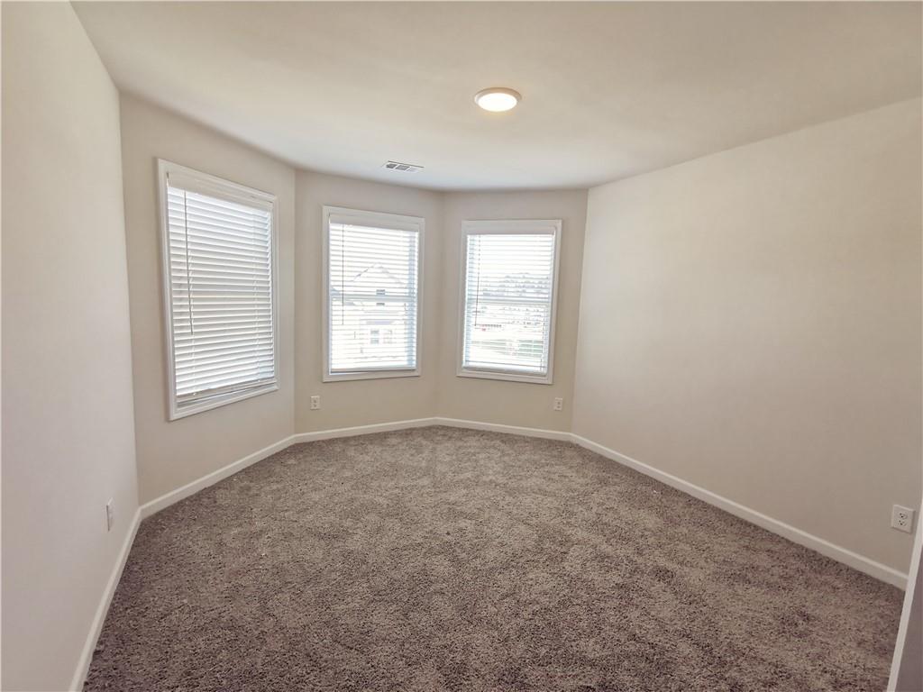 38 Longhorn Way Auburn, GA 30011 - Photo 31 of 36 an empty room with windows