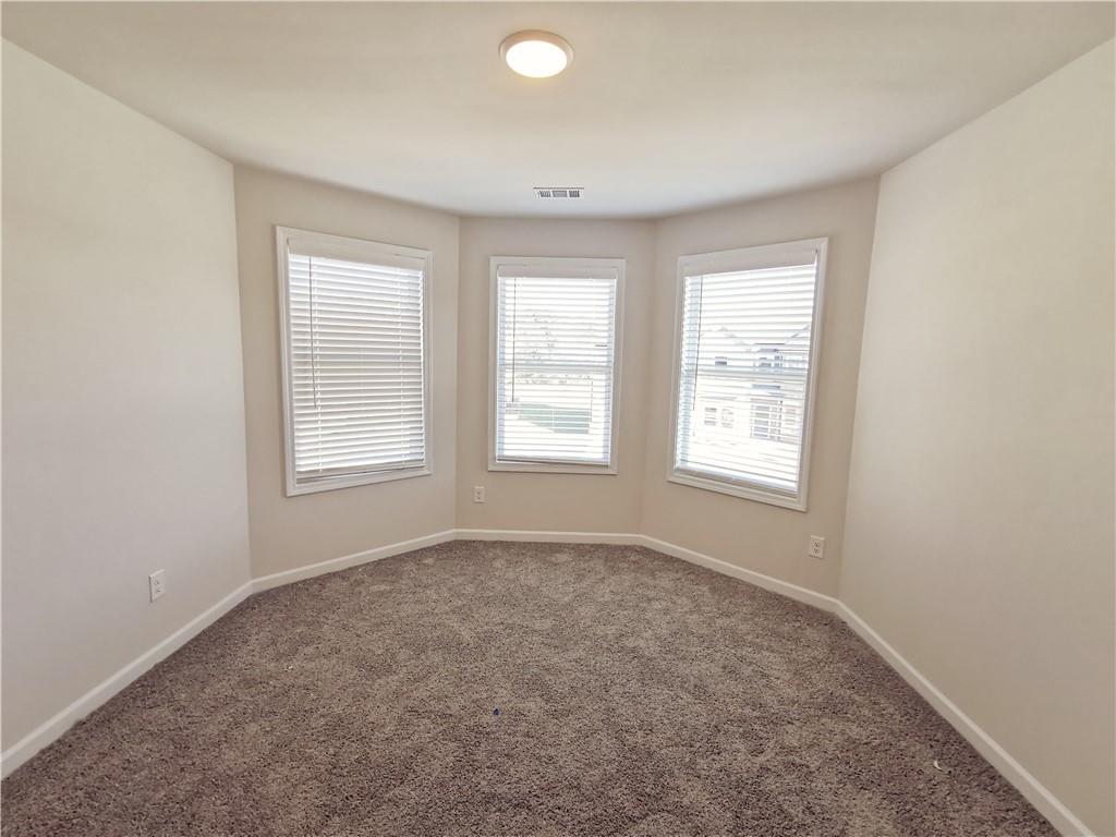 38 Longhorn Way Auburn, GA 30011 - Photo 32 of 36 an empty room with windows