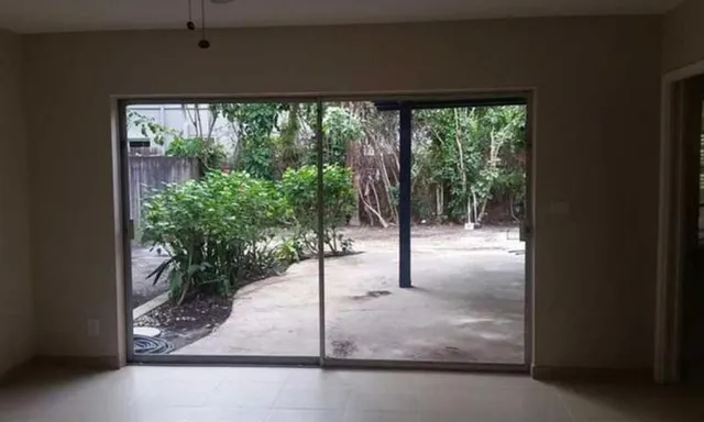 a kitchen with stainless steel appliances granite countertop white cabinets stove and a refrigerator