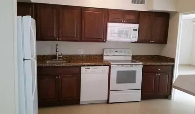 an empty room that has a window in it