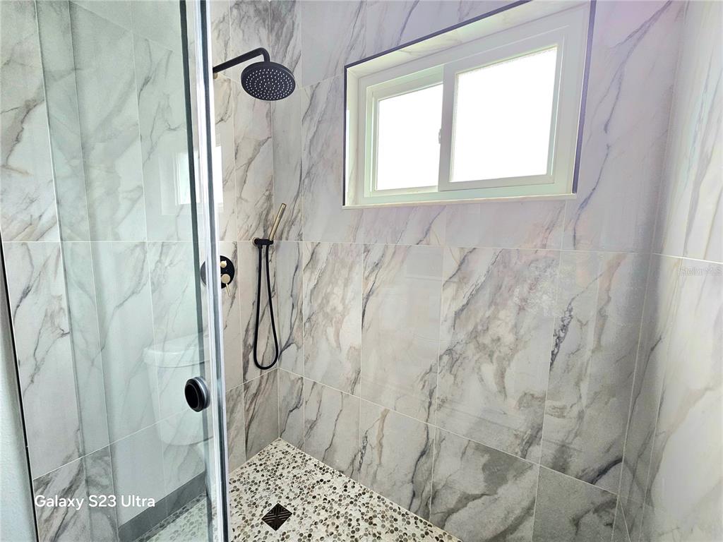 2435 Sumatran Way, Unit 35 Clearwater, FL 33763 - Photo 18 of 69 a bathroom with a shower