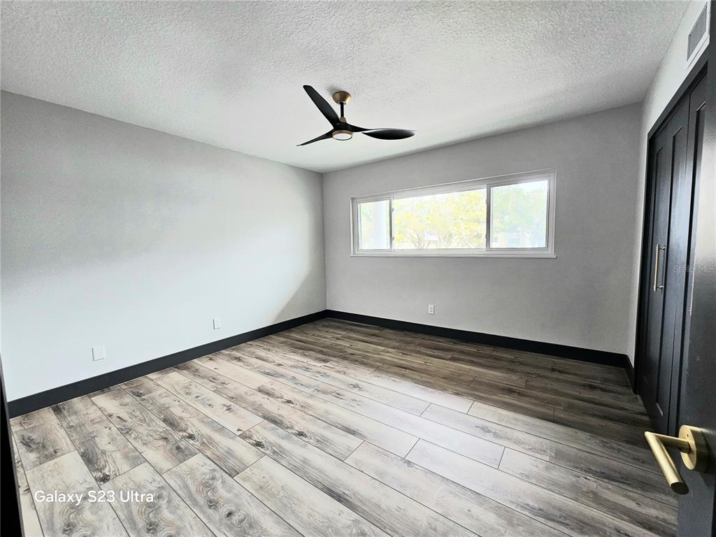 2435 Sumatran Way, Unit 35 Clearwater, FL 33763 - Photo 20 of 69 an empty room with windows