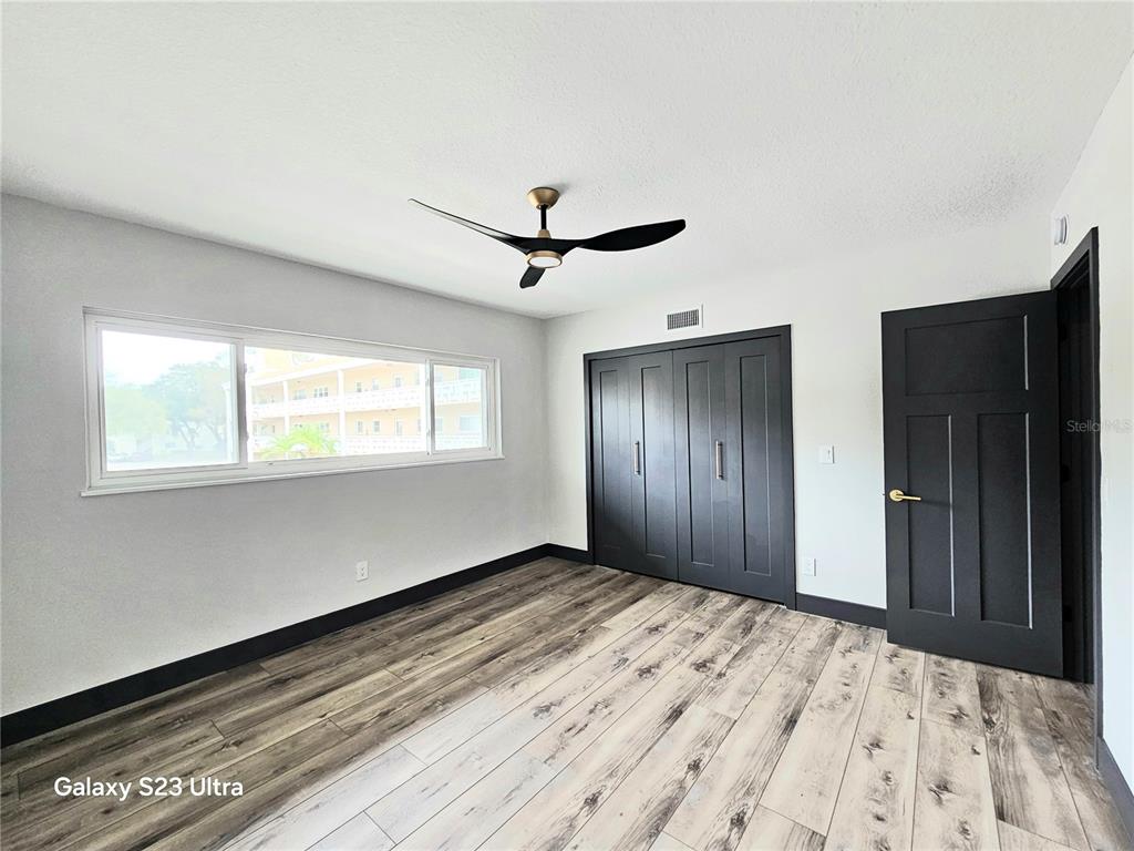 2435 Sumatran Way, Unit 35 Clearwater, FL 33763 - Photo 21 of 69 a view of an empty room with a window