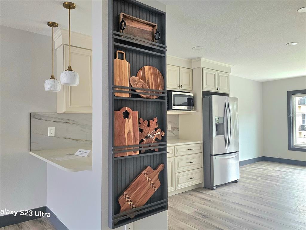 2435 Sumatran Way, Unit 35 Clearwater, FL 33763 - Photo 6 of 69 a kitchen with stainless steel appliances granite countertop a refrigerator and a sink