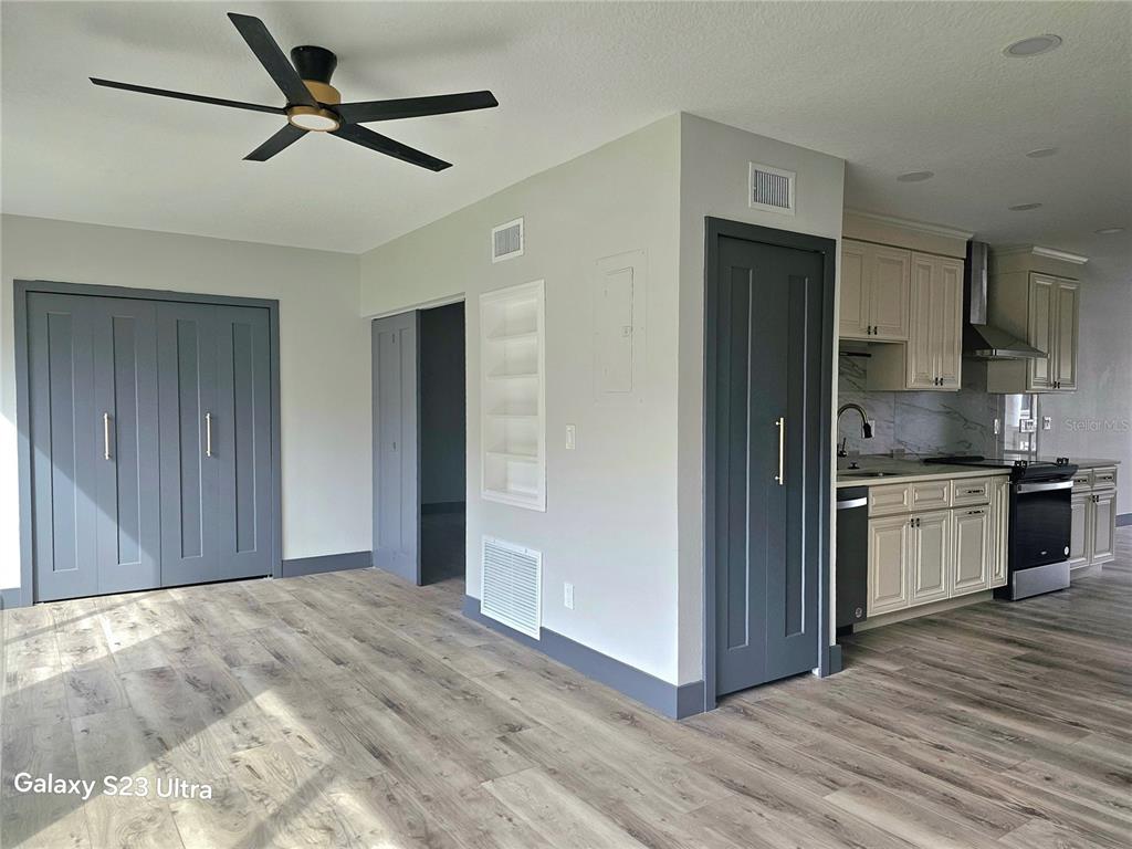 2435 Sumatran Way, Unit 35 Clearwater, FL 33763 - Photo 8 of 69 a view of a kitchen with a sink and a refrigerator