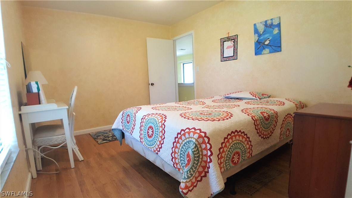 2332 Caladium Road Fort Myers, FL 33905 - Photo 11 of 17 a bedroom with a bed and a flat screen tv