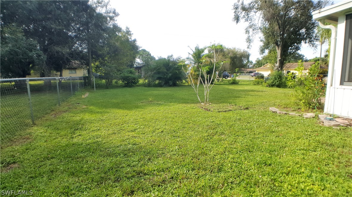 2332 Caladium Road Fort Myers, FL 33905 - Photo 16 of 17 a view of a garden with trees