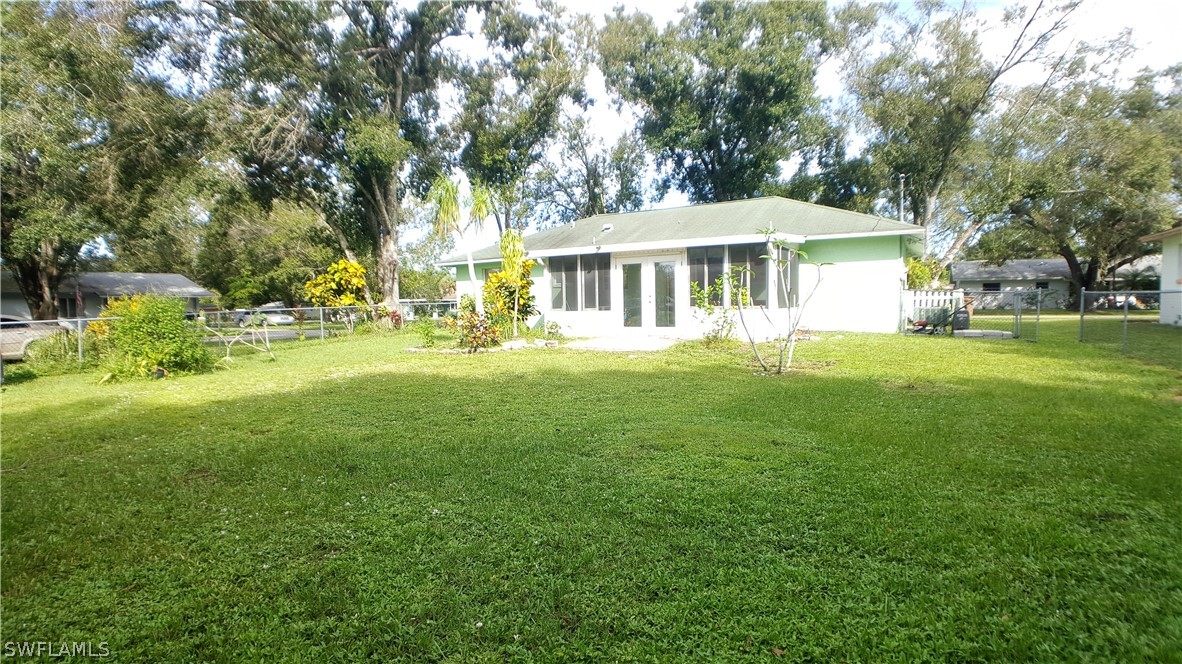 2332 Caladium Road Fort Myers, FL 33905 - Photo 17 of 17 a front view of a house with a garden