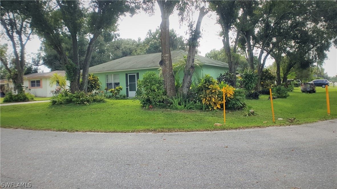 2332 Caladium Road Fort Myers, FL 33905 - Photo 3 of 17 a view of backyard of house and green space