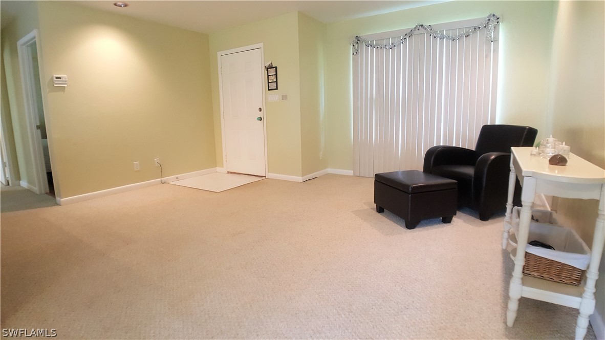 2332 Caladium Road Fort Myers, FL 33905 - Photo 4 of 17 a living room with furniture and a window