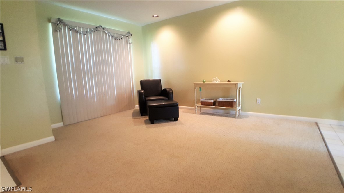 2332 Caladium Road Fort Myers, FL 33905 - Photo 5 of 17 a living room with a couch and piano table