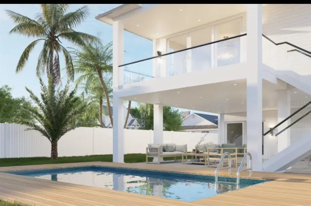 a view of living room with a floor to ceiling window and potted plants