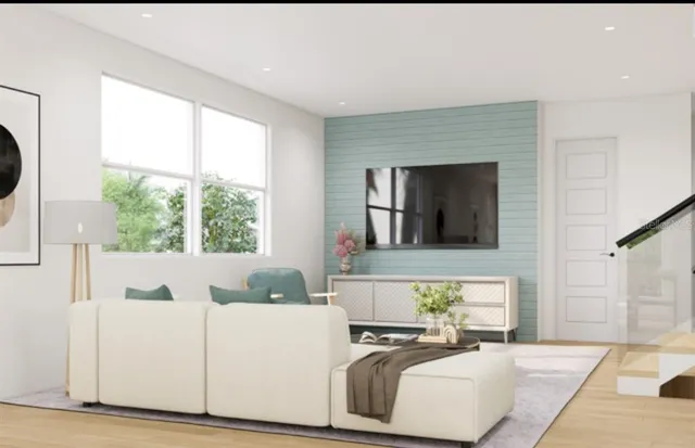 a living room with furniture and a large window