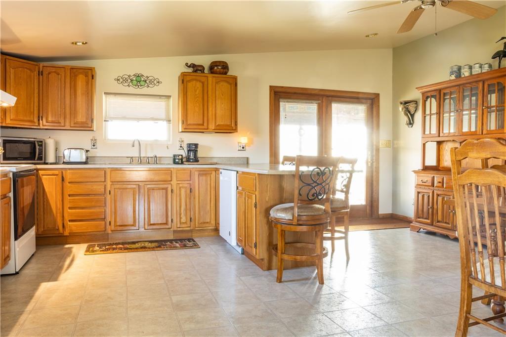 213 Unionville Road Butler, PA 16001 - Photo 12 of 38 a view of a kitchen with furniture and large windows