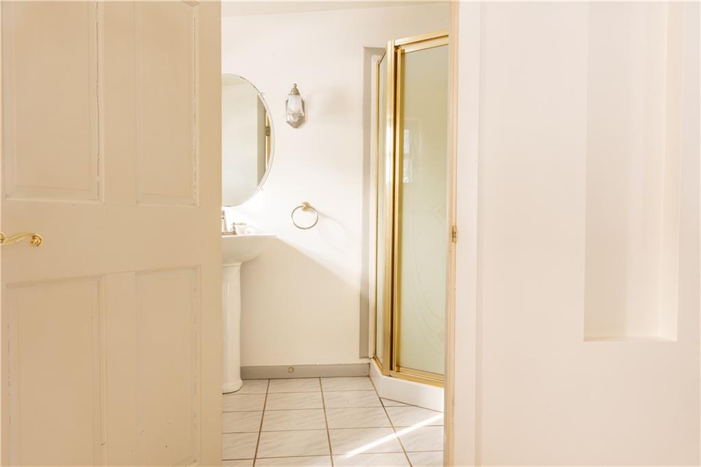 213 Unionville Road Butler, PA 16001 - Photo 18 of 38 a bathroom with a shower and a mirror