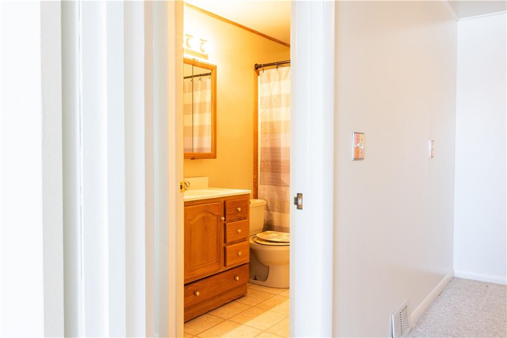 213 Unionville Road Butler, PA 16001 - Photo 28 of 38 a bathroom with a sink and a mirror