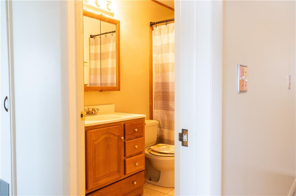 213 Unionville Road Butler, PA 16001 - Photo 29 of 38 a bathroom with a sink a toilet and a shower