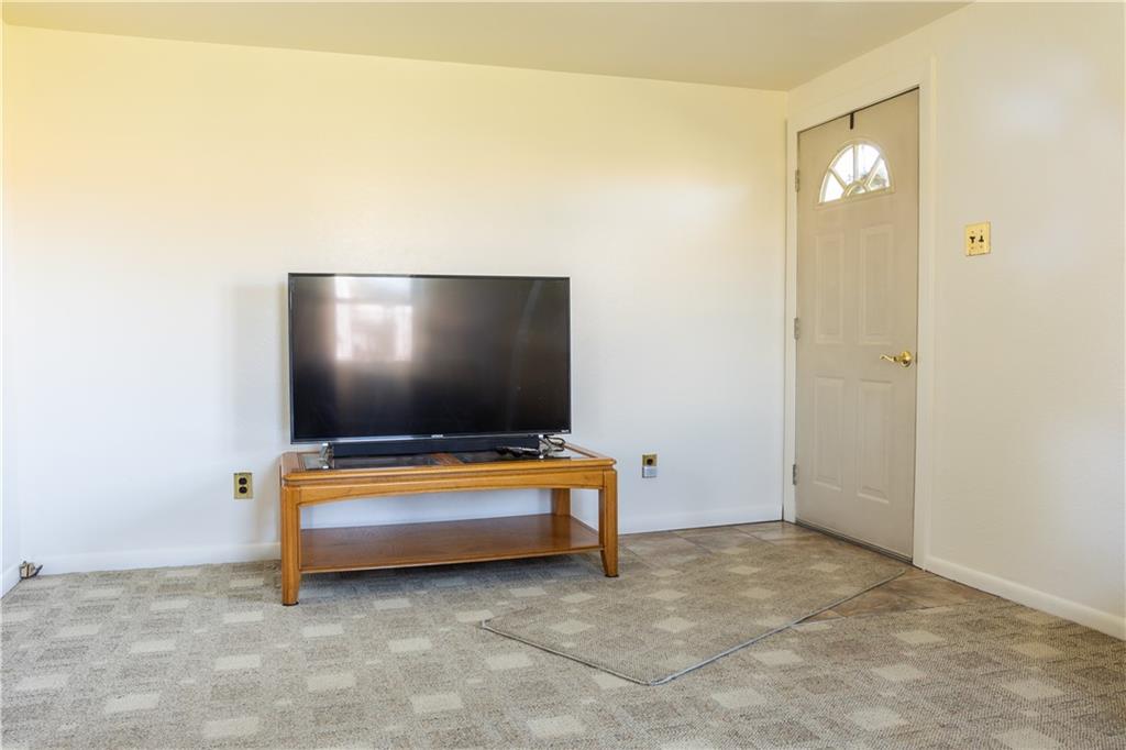 213 Unionville Road Butler, PA 16001 - Photo 4 of 38 a living room with furniture and a flat screen tv