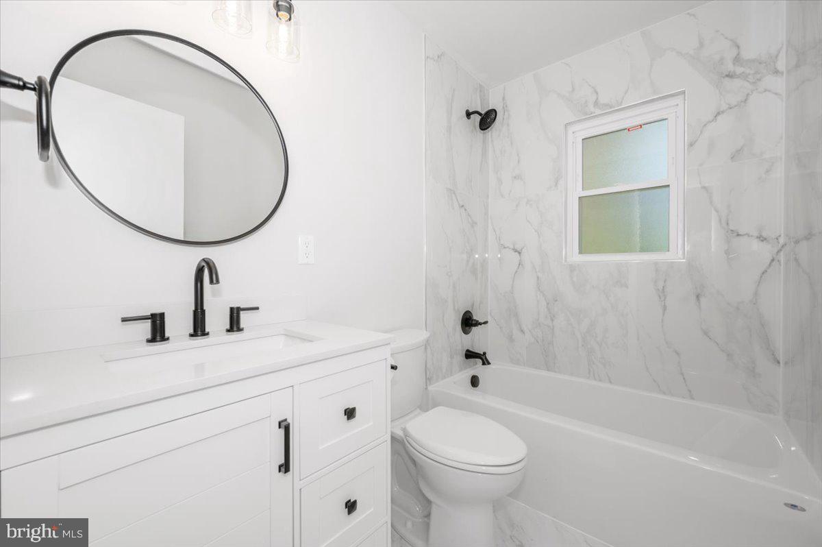 13616 Royal Road Hagerstown, MD 21742 - Photo 24 of 57 Sleek marble bath with modern accents.