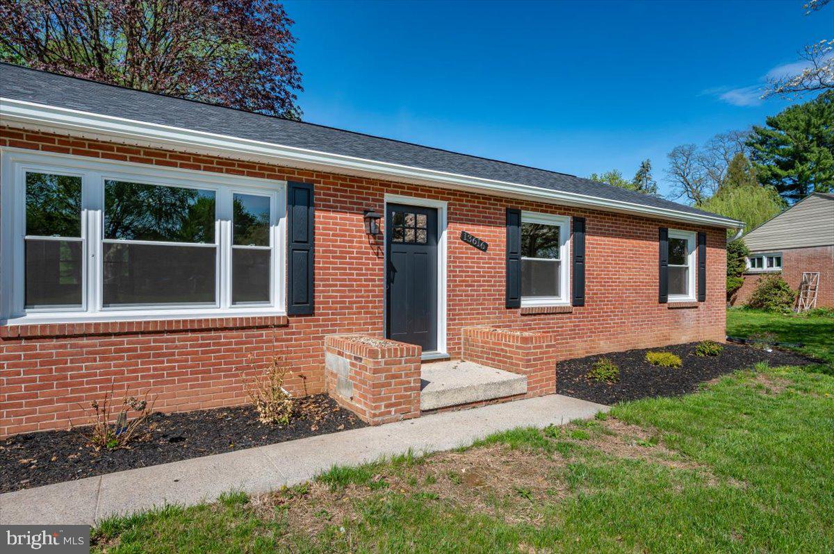 13616 Royal Road Hagerstown, MD 21742 - Photo 50 of 57 Charming brick facade with lush greenery.