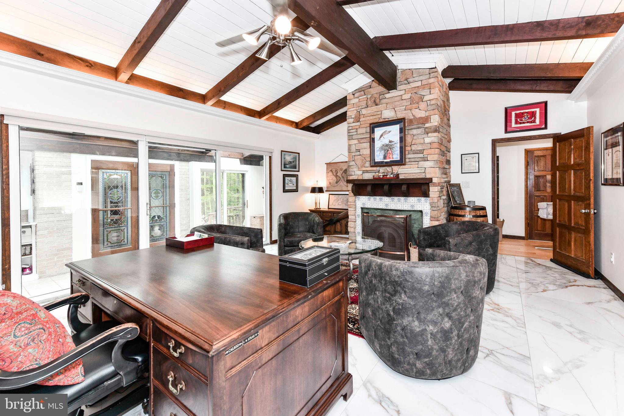 7833 Willowbrook Road Fairfax Station, VA 22039 - Photo 36 of 51 a living room with fireplace furniture and a large window