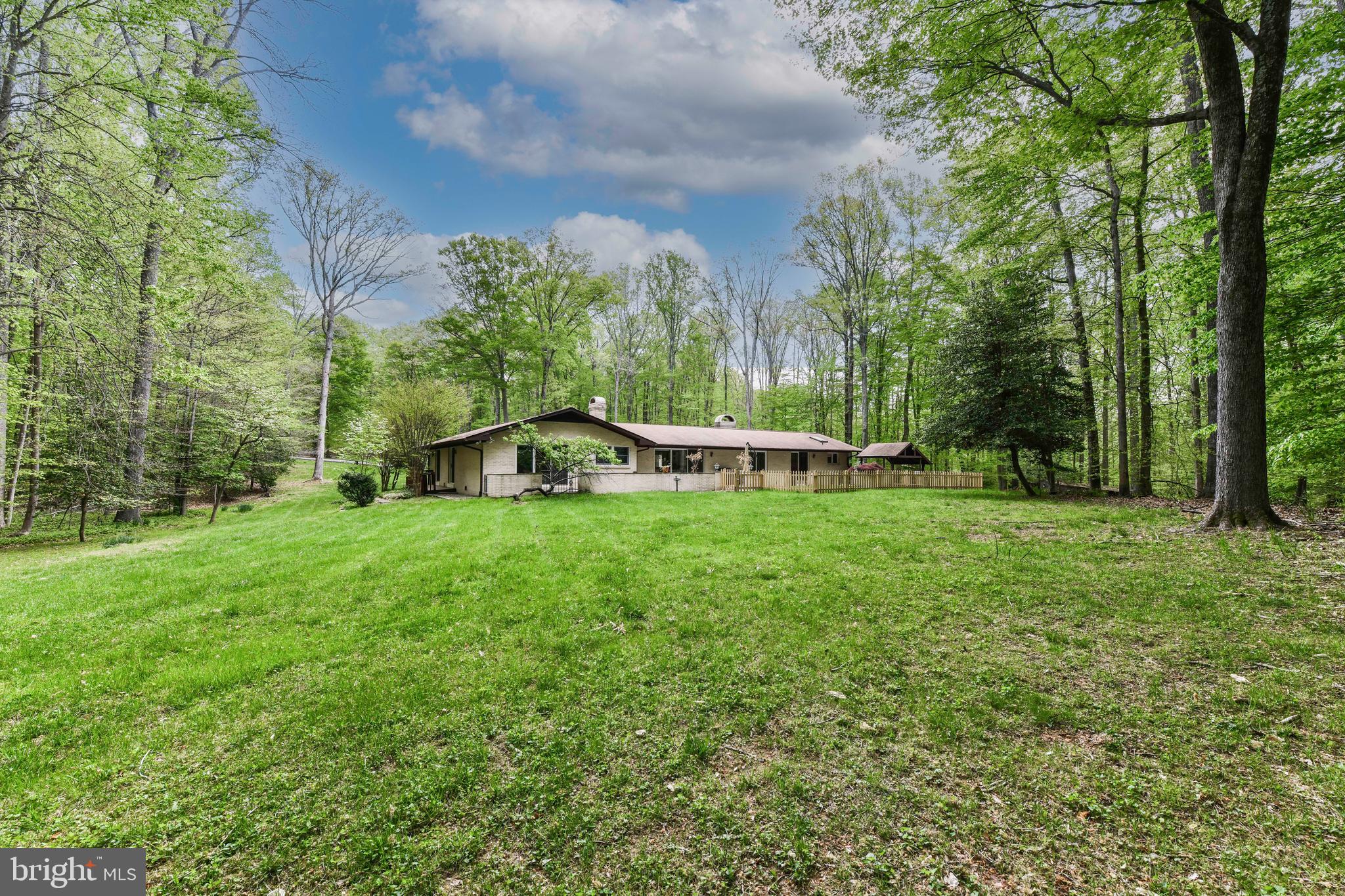 7833 Willowbrook Road Fairfax Station, VA 22039 - Photo 46 of 51 a view of a table and chairs in the garden
