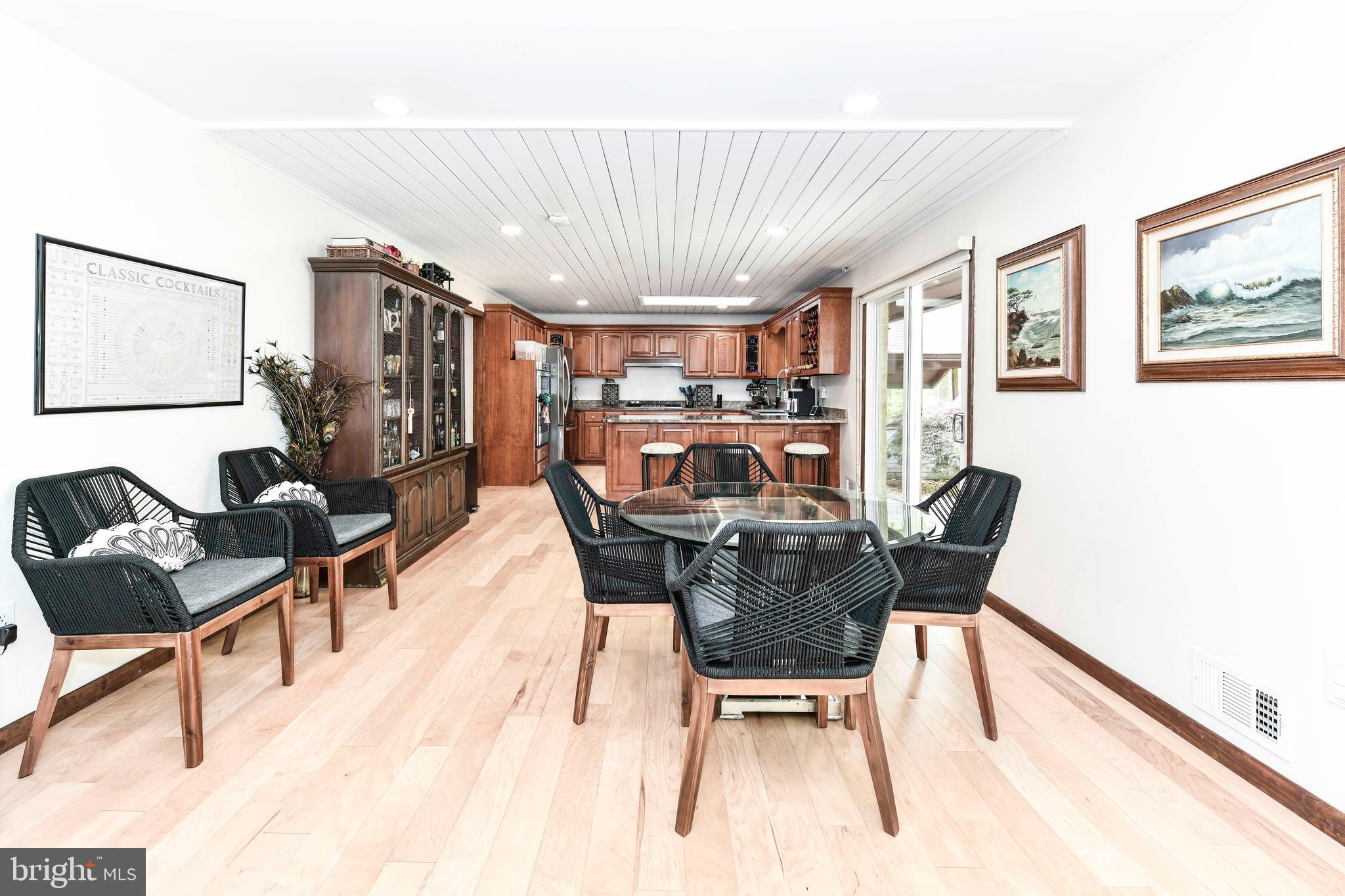 7833 Willowbrook Road Fairfax Station, VA 22039 - Photo 8 of 51 a dining room with furniture and wooden floor